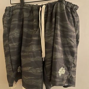 Darc Sport green camouflage shorts with white inside lining. XL size